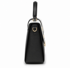 black and white top-handle satchel bag with a shoulder strap and gold-tone hardware