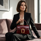 Maroon Gucci Dionysus top handle bag with a silver-tone tiger head closure.