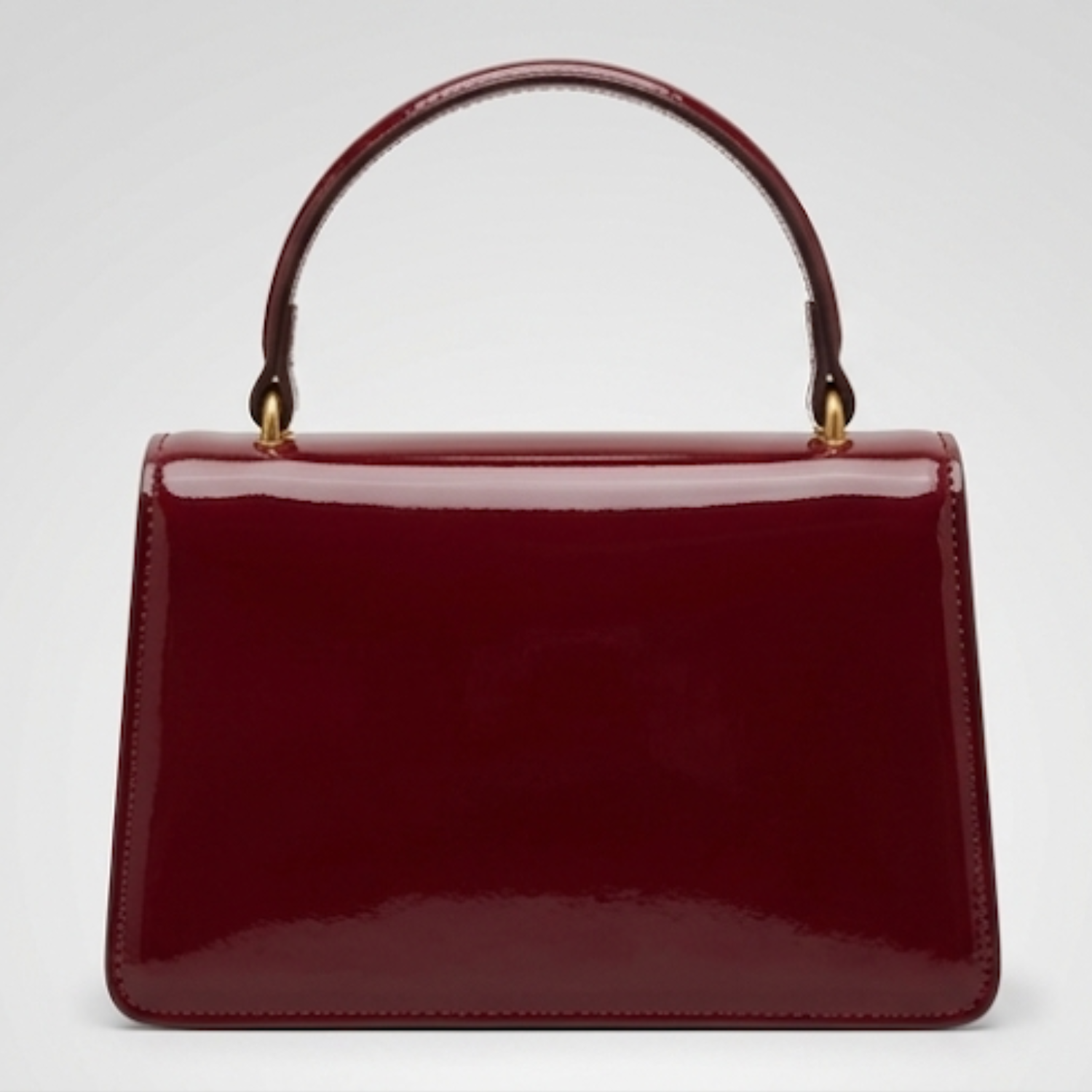 Maroon Gucci Dionysus top handle bag with a silver-tone tiger head closure.