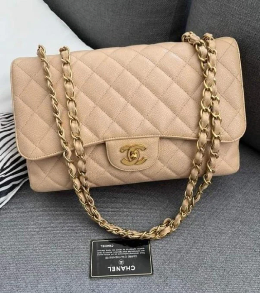Chanel Mini Flap Bag in Apricot lambskin leather with a gold-tone chain strap and CC turn-lock