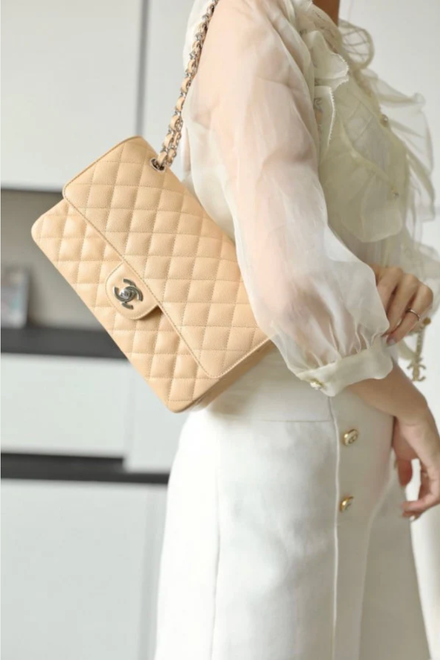 Chanel Mini Flap Bag in Apricot lambskin leather with a gold-tone chain strap and CC turn-lock