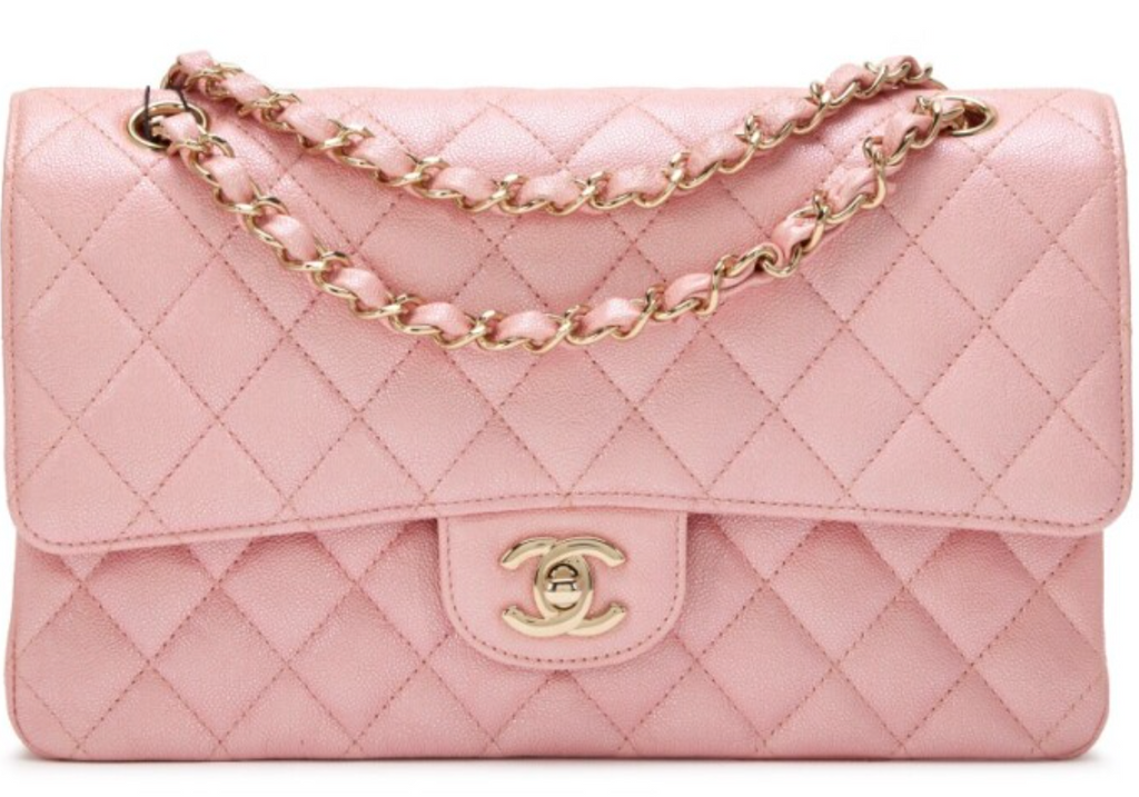 Chanel Mini Flap Bag in Pink lambskin leather with a gold-tone chain strap and CC turn-lock