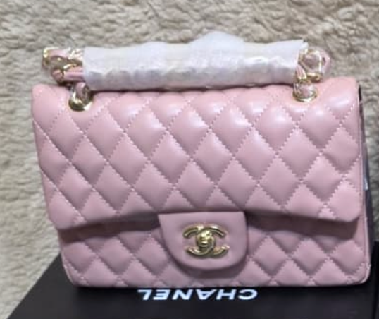 Chanel Mini Flap Bag in Pink lambskin leather with a gold-tone chain strap and CC turn-lock