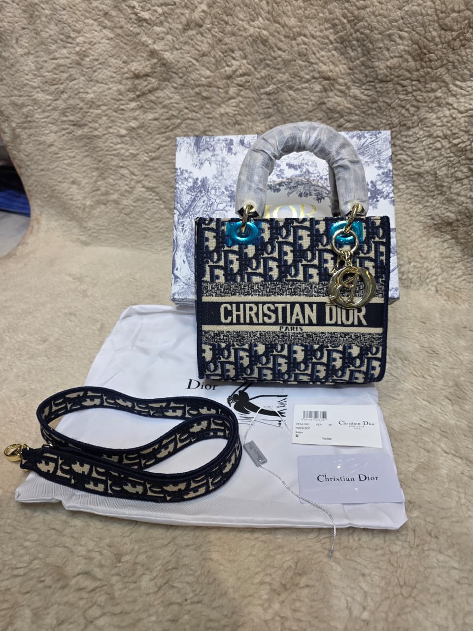 Dior Lady D-Lite bag in the mini size with blue Dior Oblique jacquard embroidery
