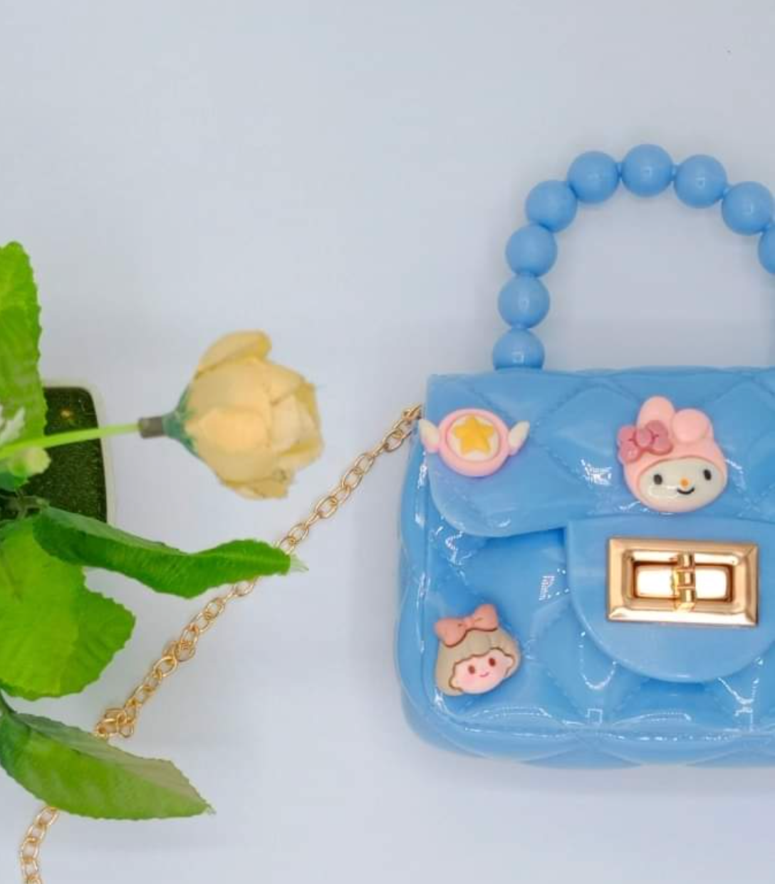 Mini Sling Bag with charms in Blue