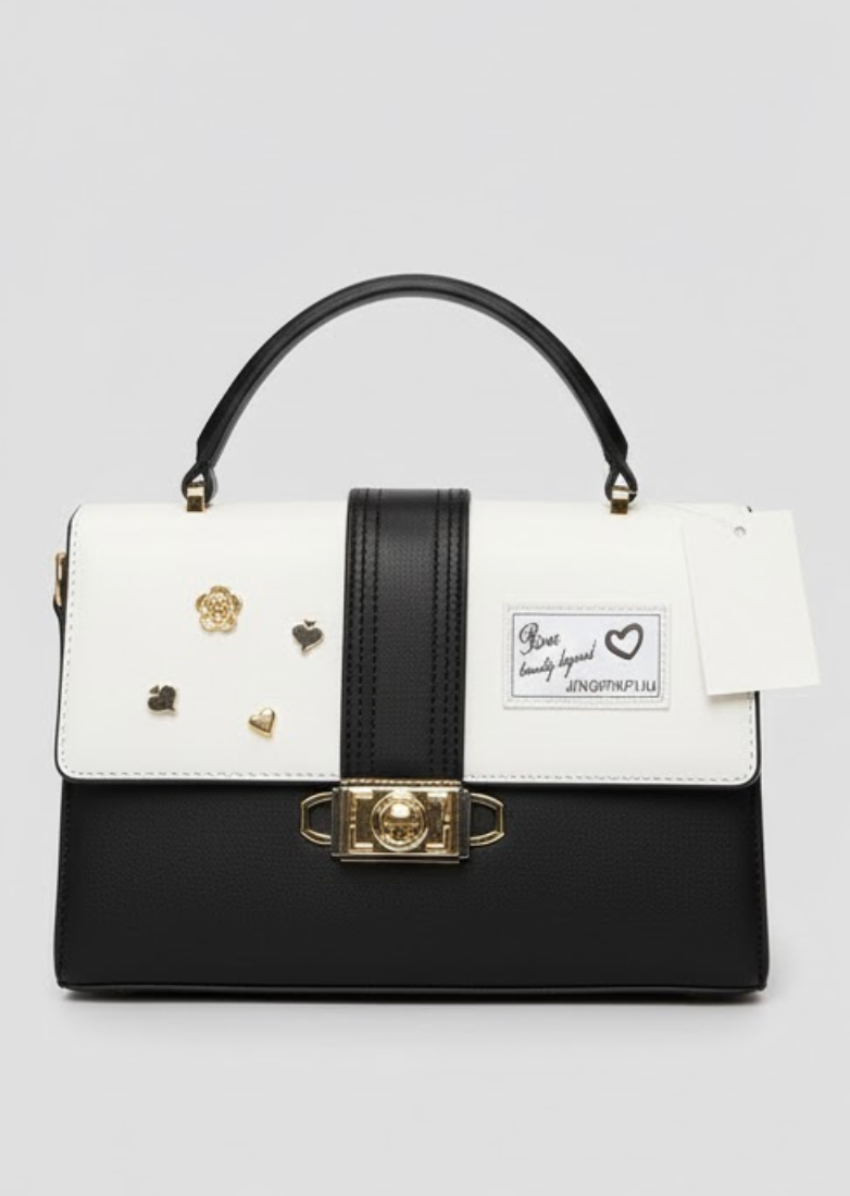 black and white top-handle satchel bag with a shoulder strap and gold-tone hardware