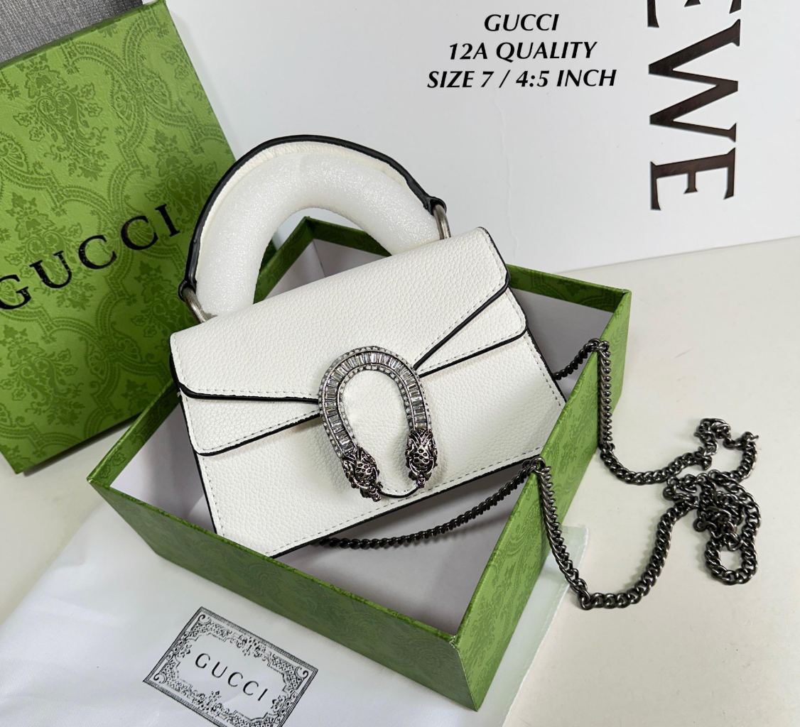 white Gucci Dionysus top handle bag with a silver-tone tiger head closure.
